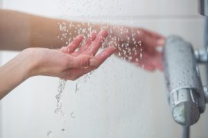 woman's hand in shower 